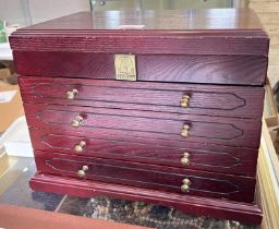 A large mahogany jewellery box with hinged lid and 3 drawers, with a selection of costume jewellery