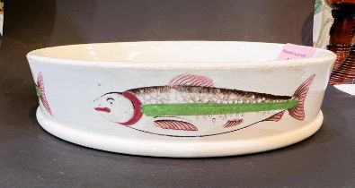 A 19th century ceramic char dish with fish to the outside, diameter 16.5cm.