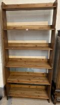 A modern pine 6 height bookcase