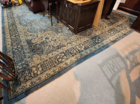 A large blue ground Persian design machine made carpet square, length approx. 460cm