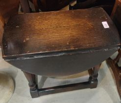 An oak small occasional table with oval drop leaf top; a reproduction mahogany dwarf sofa table;