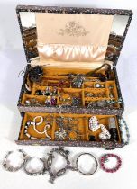 A vintage jewellery box with drawer with contents including a variety of necklaces, brooches and