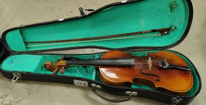 A 20th century students two piece backed violin in hard carry case with bow full size