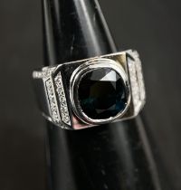 A gent's white metal square top dress ring with blue cushion sapphire (10.6 x 9.7 x 6.5mm) on