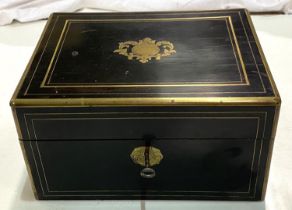 A 19th century ebonised and brass box with silver and copper lidded fitted jars in fitted sections.