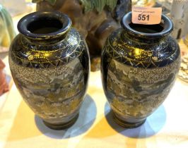 A pair of early 20th century Japanese Satsuma baluster vases decorated with reverse panels with