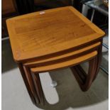 A nest of 3 teak occasional tables by Nathan