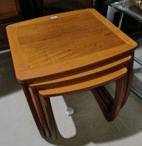 A nest of 3 teak occasional tables by Nathan