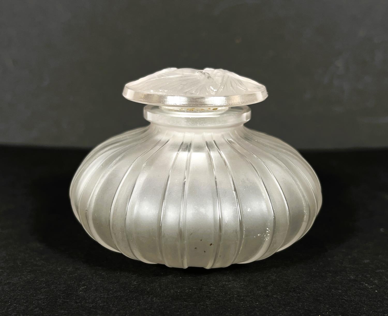 A LALIQUE scent bottle of squat ribbed form, the stopper moulded with 3 moths, R. Lalique, France,