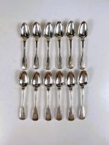 A hallmarked silver set of 12 tea/fruit spoons, fiddle thread and shell pattern, monogrammed, London