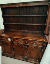 An oak reproduction Titchmarsh and Goodwin style Welsh dresser with 3 panelled doors below, and 3