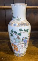A large Chinese porcelain vase decorated with figures on horseback plants and animals, height 37cm