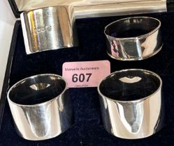 A hallmarked silver part set of 3 napkin rings and a matched ring, cased, 6oz