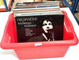 A collection of 1960's onwards records, including the Rolling Stones, The Moody Blues, Neil Young