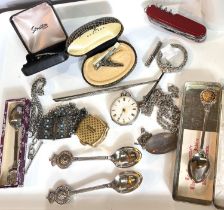 A key wound fob watch in chased white metal (dial a.f.); an unmarked white metal chain; a dip pen;