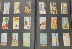 An Album of cigarette cards and an album of stamps