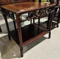 A 19th century Chinese hardwood rectangular table with carved detail stepped legs and under lower