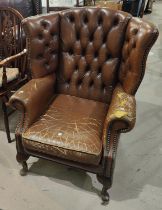 A brown leather deep buttoned armchair (a/f)