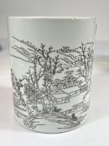 A Chinese ceramic cylindrical brush pot with monochrome sgraffito style decoration depicting