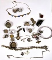 An Art Nouveau gilt necklace set with blue stones, a silver and shell brooch cameo, other silver
