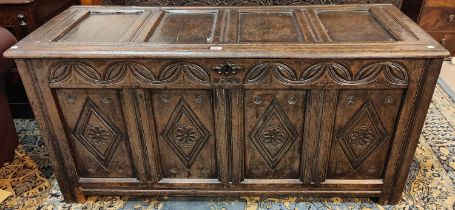 An 18th century framed and panelled oak bedding box with hinged lid and block feet, width 145cm