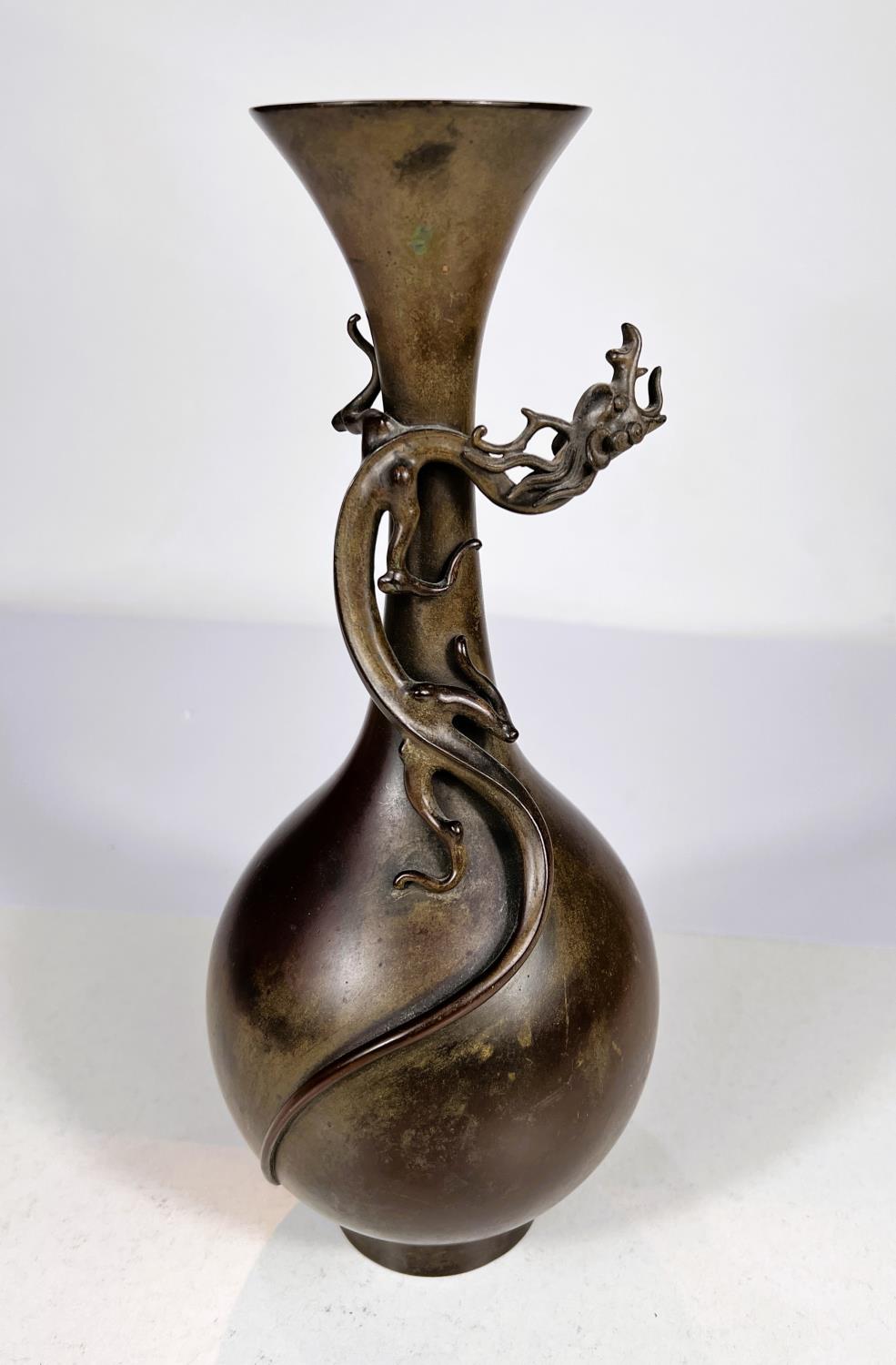 A Japanese Meiji period bronze vase with relief dragon climbing around the neck of vase, with etched
