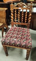 A Victorian walnut hall chair with barley twist column legs