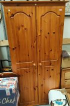 A modern pine double door wardrobe in Ducal style, ht. 184 x 91cm and a three height chest