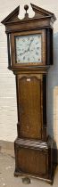 An early 19th century golden oak longcase clock crossbanded in mahogany by Tho Holmes, Cheadle, head