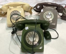 Three 1970's vintage telephones in ivory, green and grey