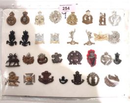 A collection of military collar badges, 31.