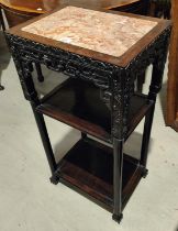 A Chinese 19th century table with marble top carved hardwood decoration, three height, with ball and