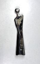 A white metal modernist unusual shoehorn in the form of a female, signed Carrol Boyes, South Africa,