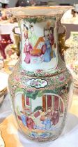A 19th century Chinese baluster vase decorated in the famille manner with panels of exotic birds and
