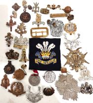 A collection of military badges, cap and others.