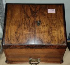 An Edwardian walnut desk top organiser with sloped front, various interior shelves etc with drawer