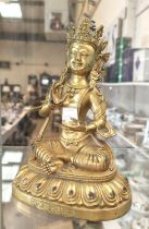 A Chinese gilded bronze buddha seated in lotus position, fine details, characters to the front,