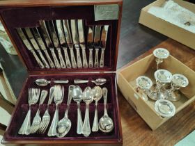 A canteen of EPNS beaded cutlery by Inkerman and silver plated candlesticks