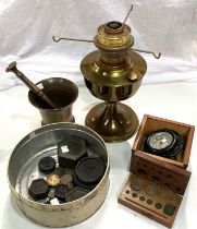 A 19th century bronze pestle and mortar; a brass oil lamp; a gimble compass in mahogany box; a