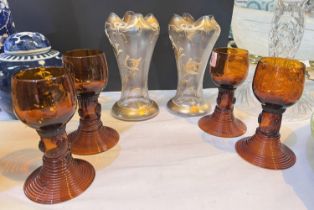 A pair of Venetian glass posy vases with gilt decoration and four German amber glass roemer wine