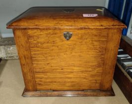 A golden oak fall front tobacco cabinet with hinged lid, interior drawer with two compartments