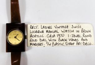 A Lucerne unusual vintage lady's wristwatch, mechanical with gold dial set in brown plastic case,