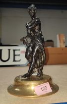 A late 19th/ early 20th century French bronze of classical style female on brass plinth, height 23cm