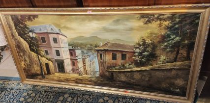 A large oil on canvas Continental scene overlooking houses, signed indistinctly 79 x 179cm