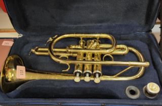 A John Packer gilt trumpet in carry case