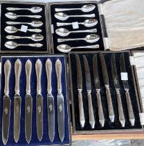 Three hallmarked silver sets of tea/coffee spoons, cased, 4oz; 2 sets of silver handle tea knives