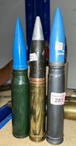 A 27mm Manse round with blue inert projectile and a similar 27mm round.