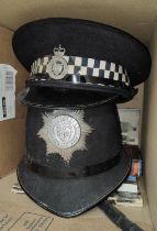 A 'police Helmet'; a police Cheshire Constable flat cap and two books.