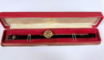 An unusual asimetric gold cased ladies Breitling wristwatch in box with later strap