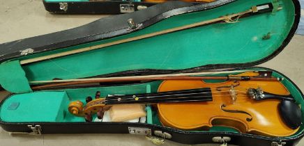 A 20th century Lark students violin with two piece back, carry case and two bows